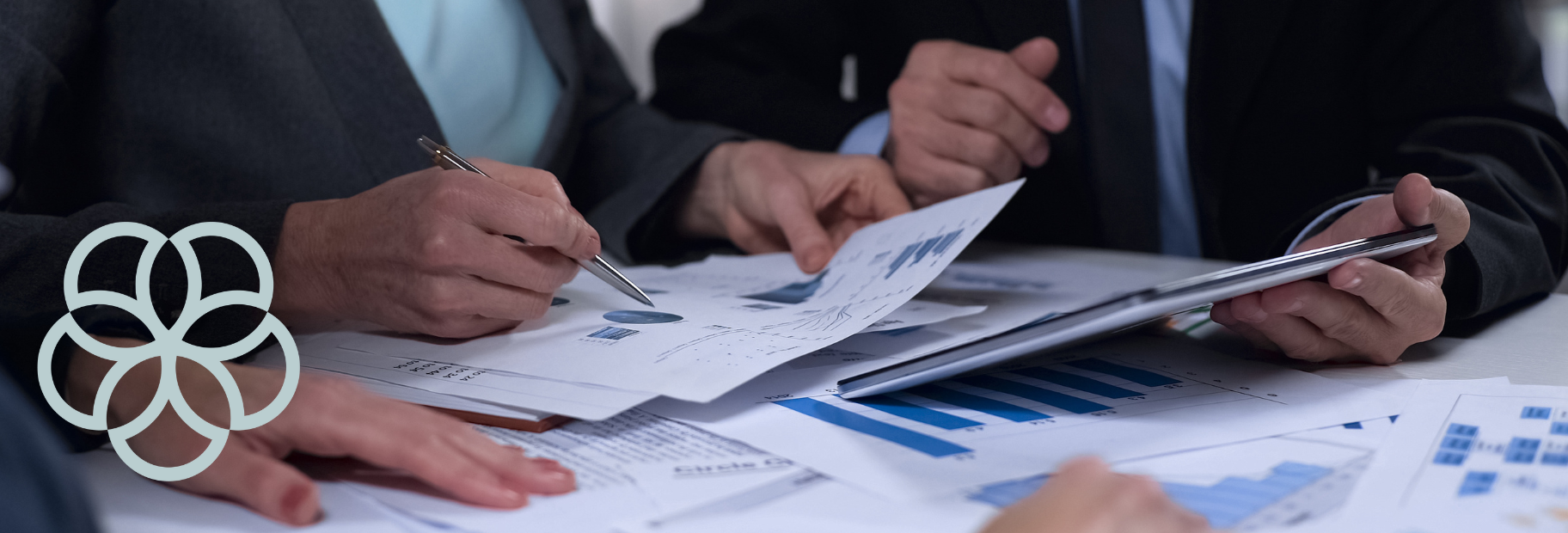 Multiple hands on papers